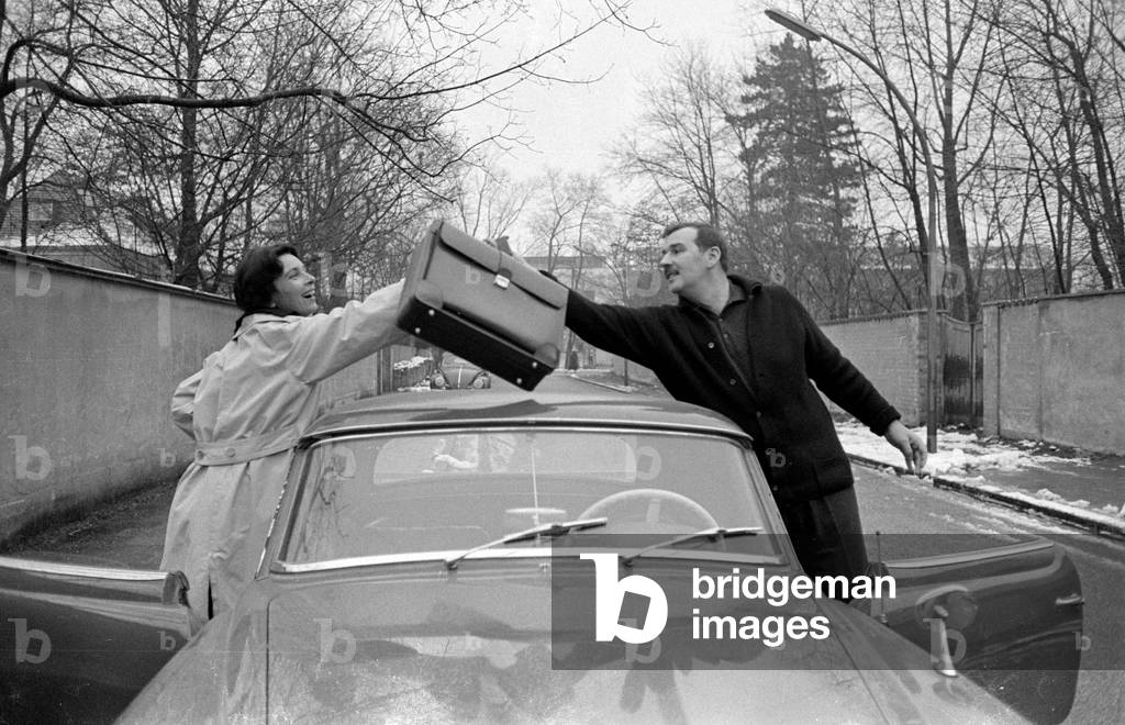 Bernhard Wicki and Agnes Fink at their sports car, 1959 (b/w photo)
