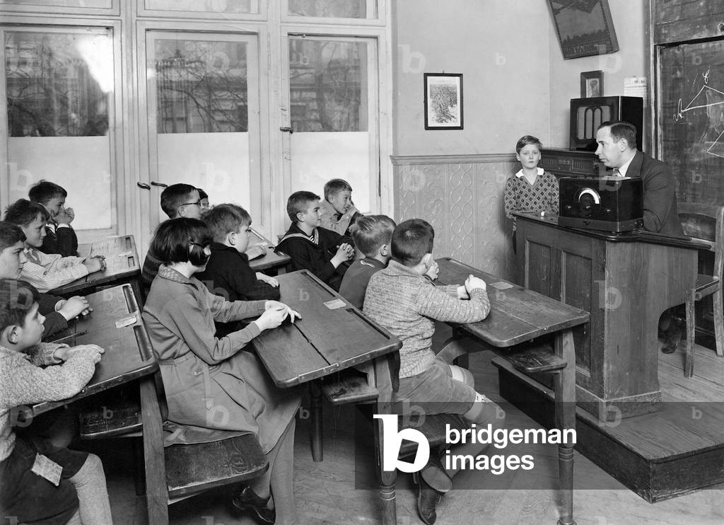 School class listening to the radio, 1934 (b/w photo)