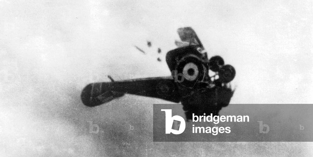 British fighter plane breaks apart in the air (b/w photo)