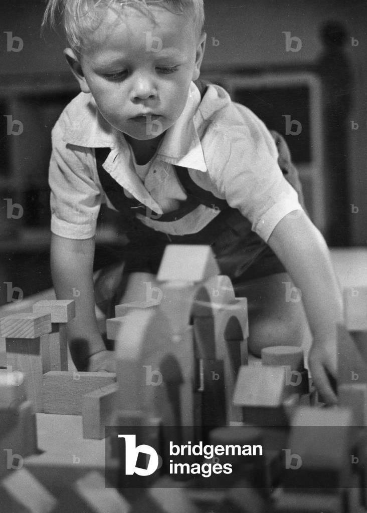A playing toddler, 1959 (b/w photo)