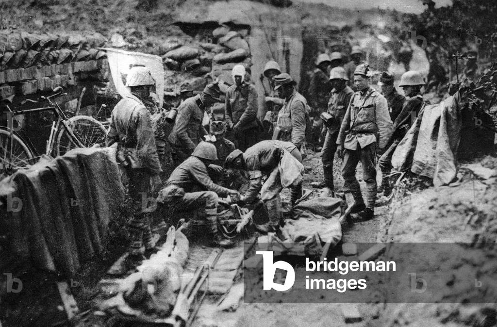 Wounded soldiers at a dressing station, 1917 (b/w photo)