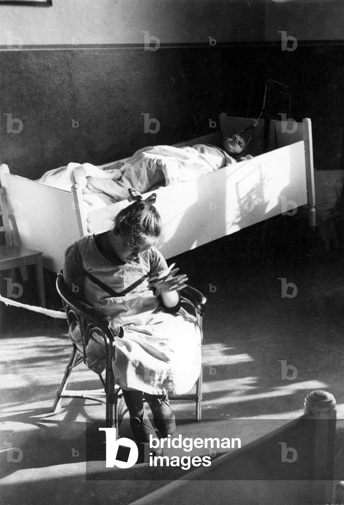 Disabled women in a home in the 1930s (b/w photo)