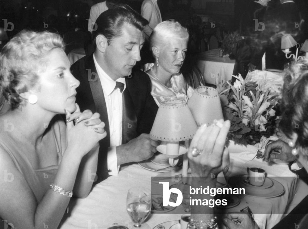Robert Mitchum and Nicole Milinaire, 1957 (b/w photo)