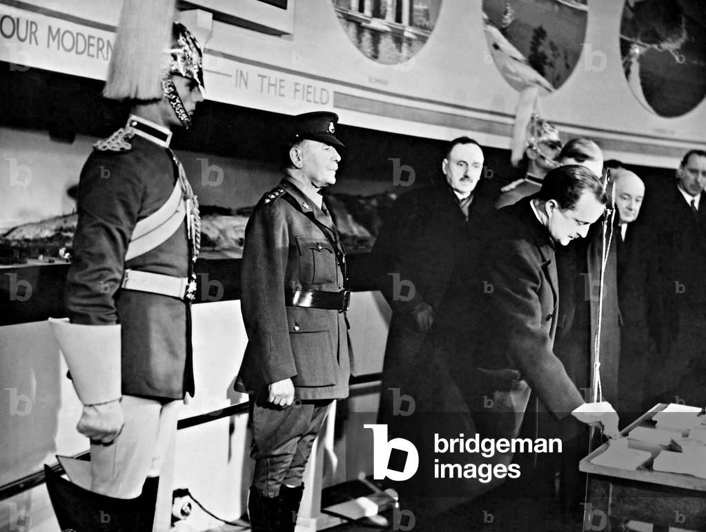 Duff Cooper opens up a military exhibition, 1937 (b/w photo)