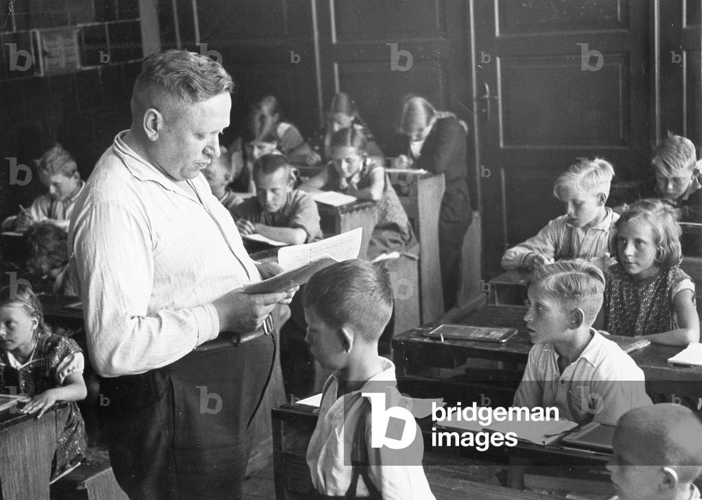 Teachers and students in the class, 1935 (b/w photo)