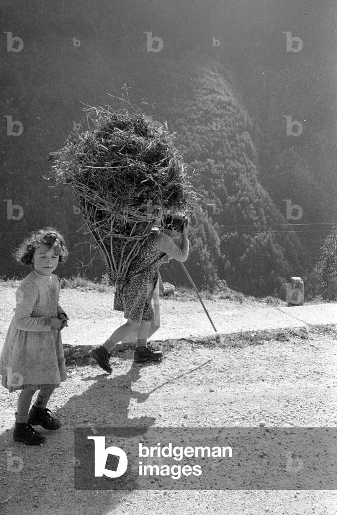 Woman with carrying frame, 1960 (b/w photo)