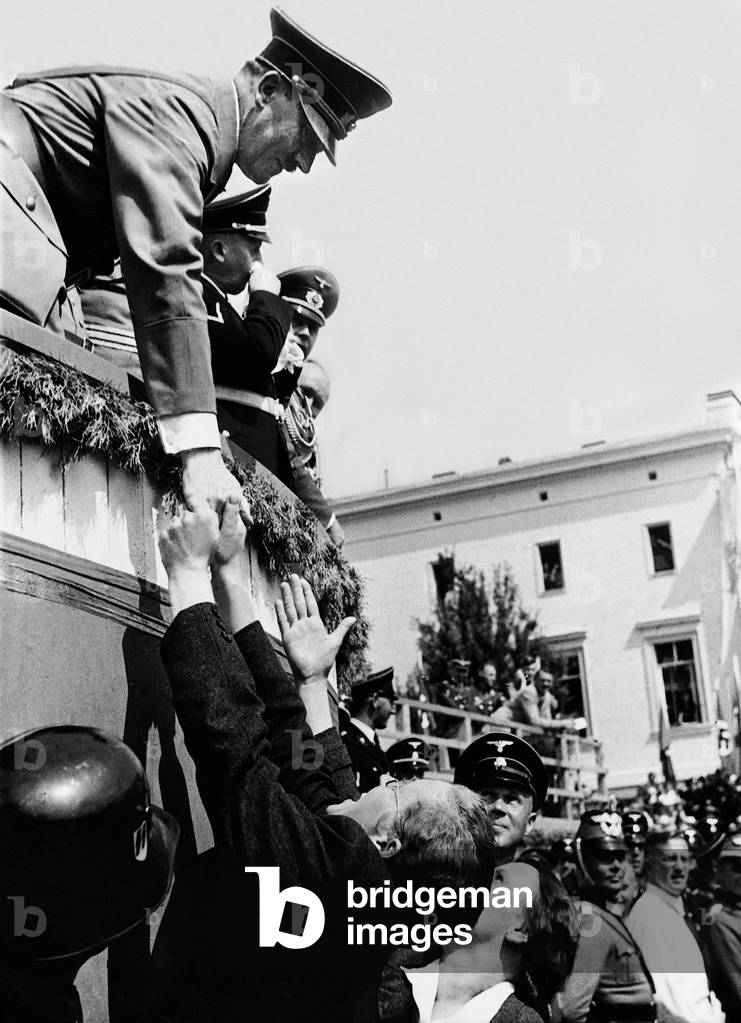 Adolf Hitler shakes hands, 1938 (b/w photo)