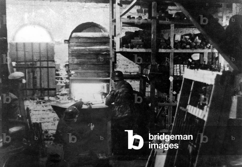 German soldiers in position in a warehouse in Breslau, 1945 (b/w photo)