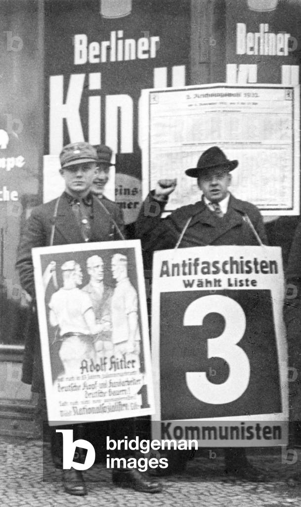 SA man and a Red Front Fighter in front of the polling station, 1932