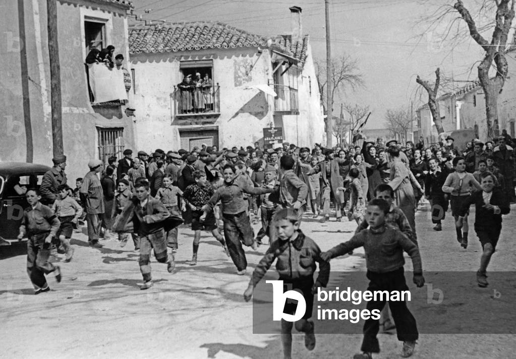 Cheering people during Franco's invasion at Madrid, 1939