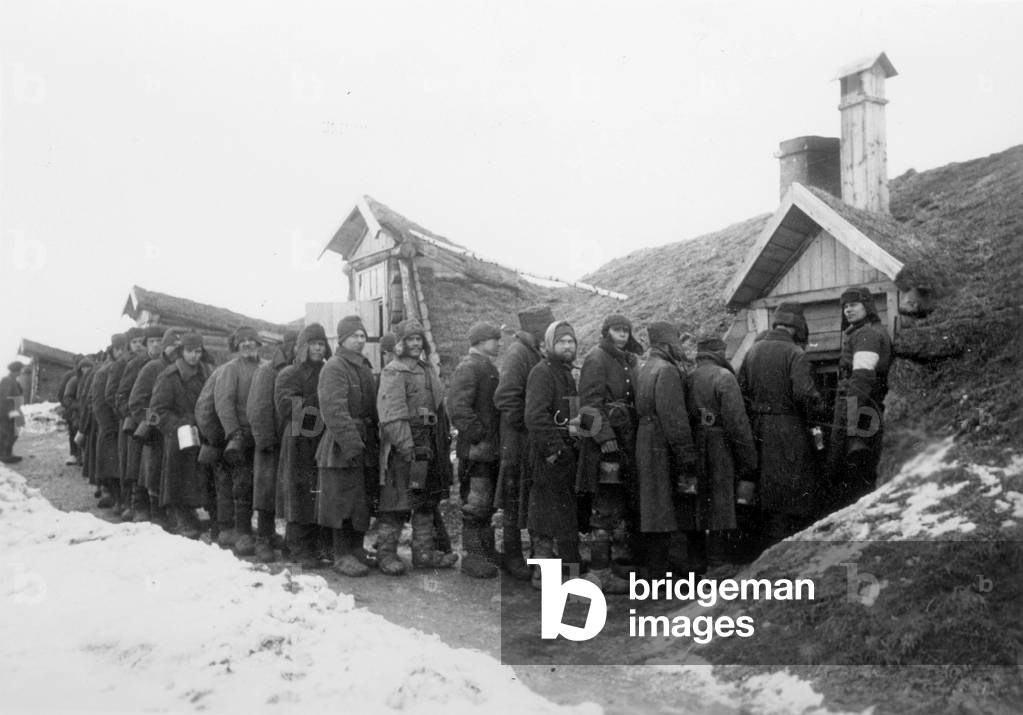 Soviet prisoners of war in line for food, 1943 (b/w photo)