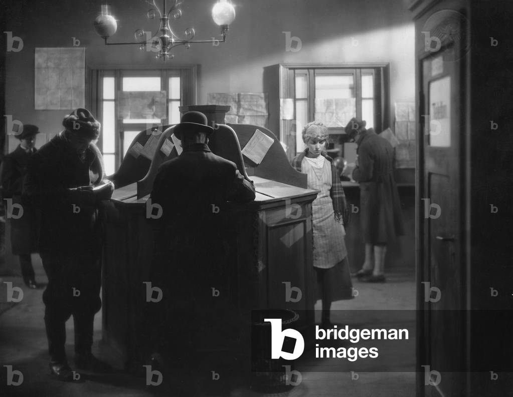 Customers in a post office (b/w photo)