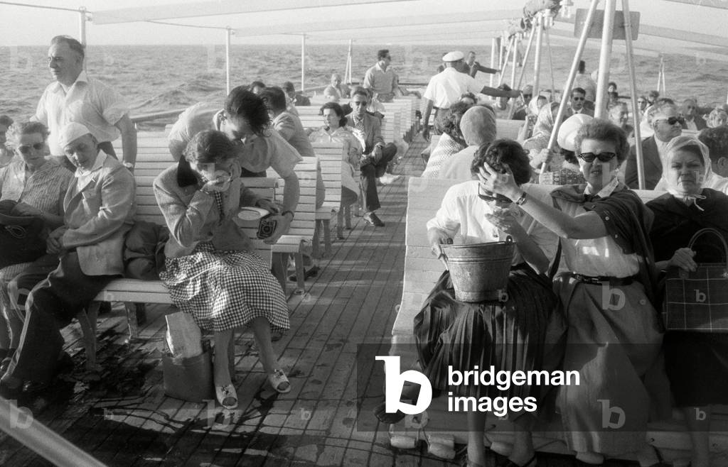 The short boat transfer from Naples is not always pleasant, 1957 (b/w photo)