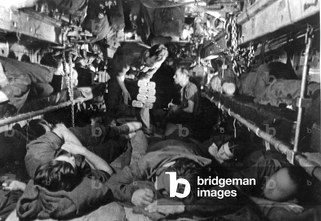 Sleeping crew in a submerged German U-boat in the Second World War (b/w photo)