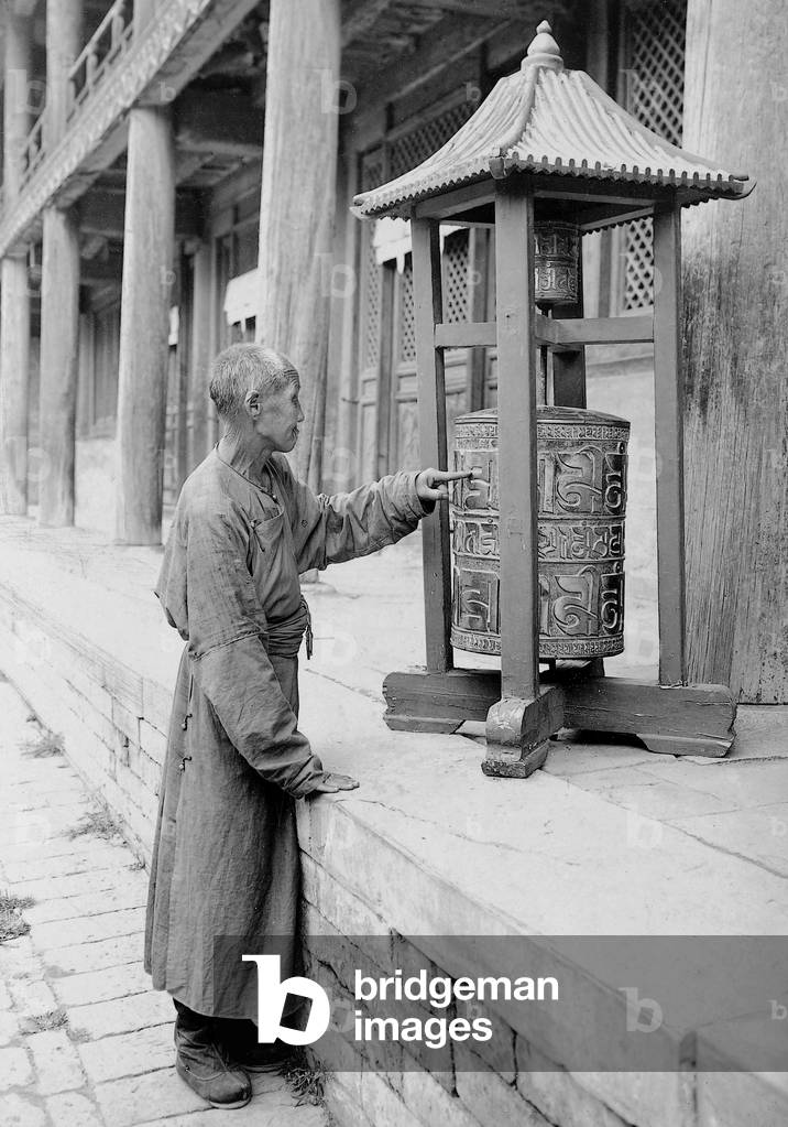 Prayer wheel in Tibet, 1908 (b/w photo)