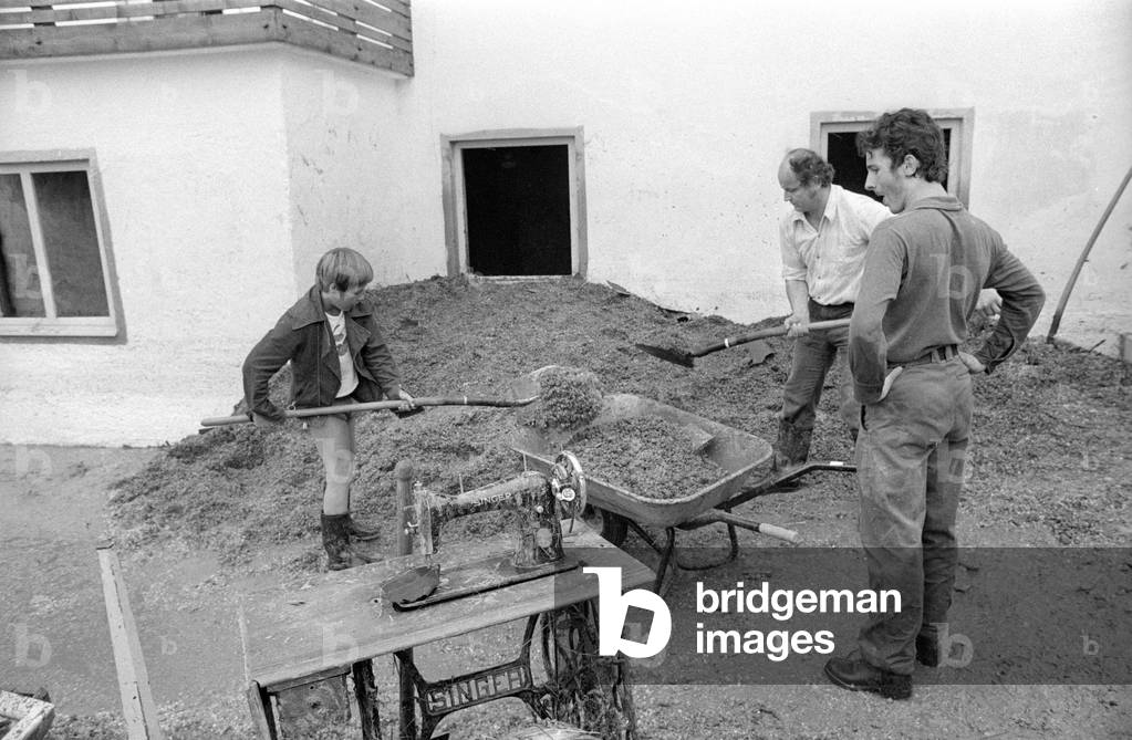 Cleaning up after a storm at Lake Chiemsee, 1974 (b/w photo)