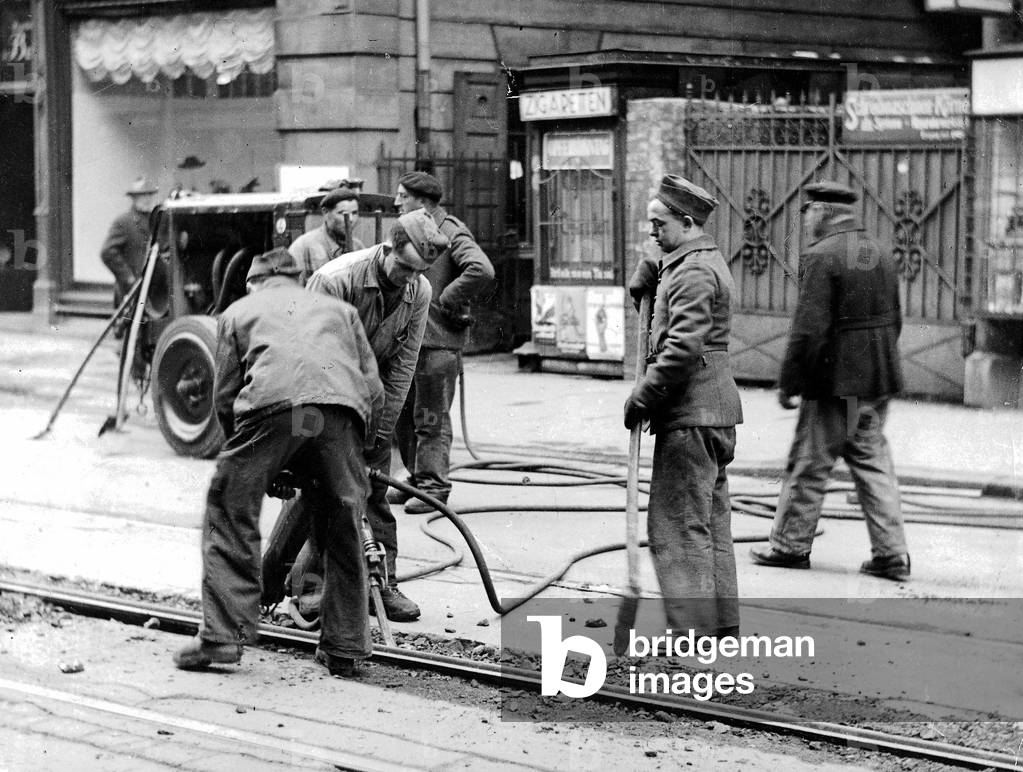 French forced laborers during track work in Munich 1939 (b/w photo)