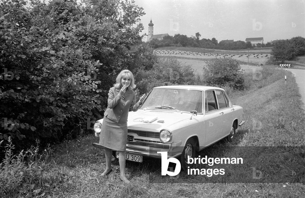 A woman posing with a Glas 1700, 1963 (b/w photo)