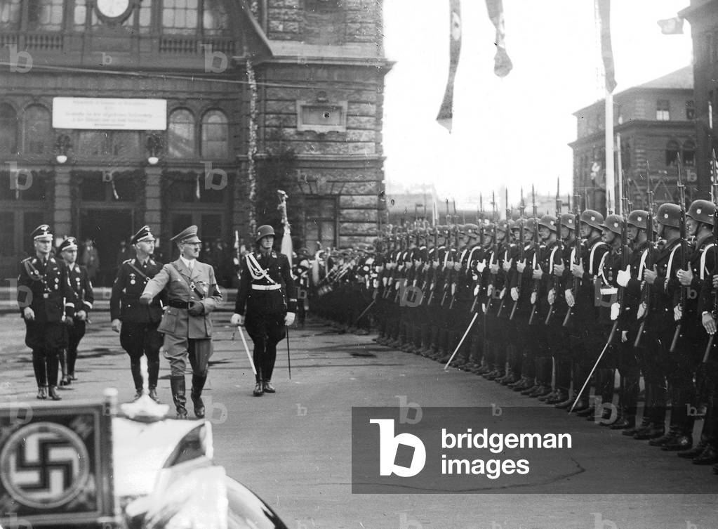 Adolf Hitler, Heinrich Himmler and Karl Wolff in front of the main train station in Nuremberg, 1936 (b/w photo)