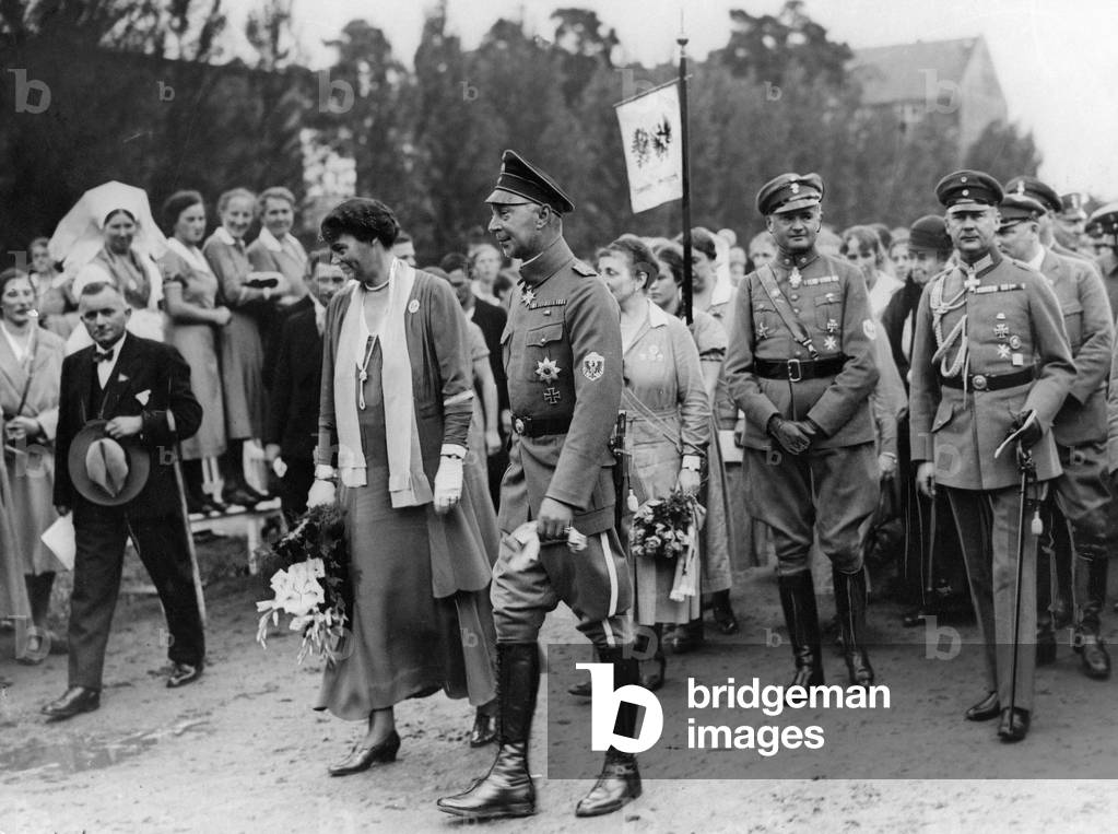 The Prussian crown prince and princess at a rally, 1932
