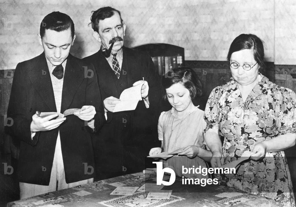 Issuing of food ration cards in London, 1939 (b/w photo)