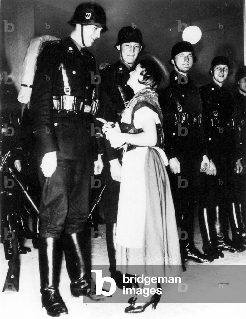 SS Bodyguard Regiment 'Adolf Hitler' admired by an Austrian girl (b/w photo)