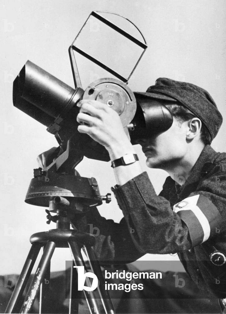 Latvian volunteer at anti-aircraft warfare, 1944 (b/w photo)