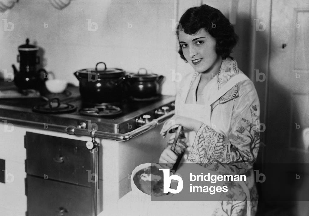Jenny Jugo in her kitchen, 1929 (b/w photo)