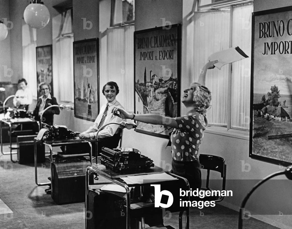 Office staff at the workplace, 1933 (b/w photo)