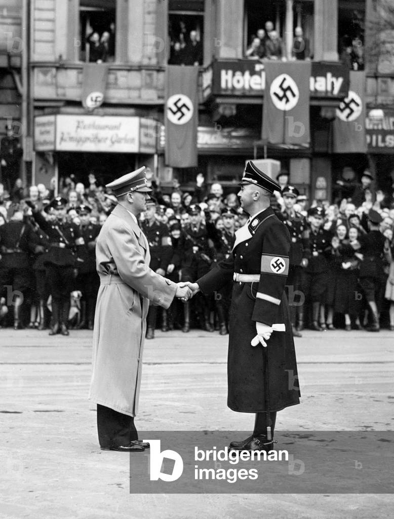 Adolf Hitler shakes hands with Heinrich Himmler, 1938 (b/w photo)