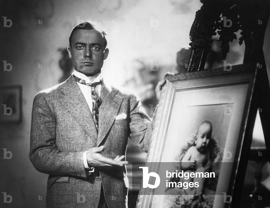 Actor Heinz Ruehmann during a movie scene. 1930