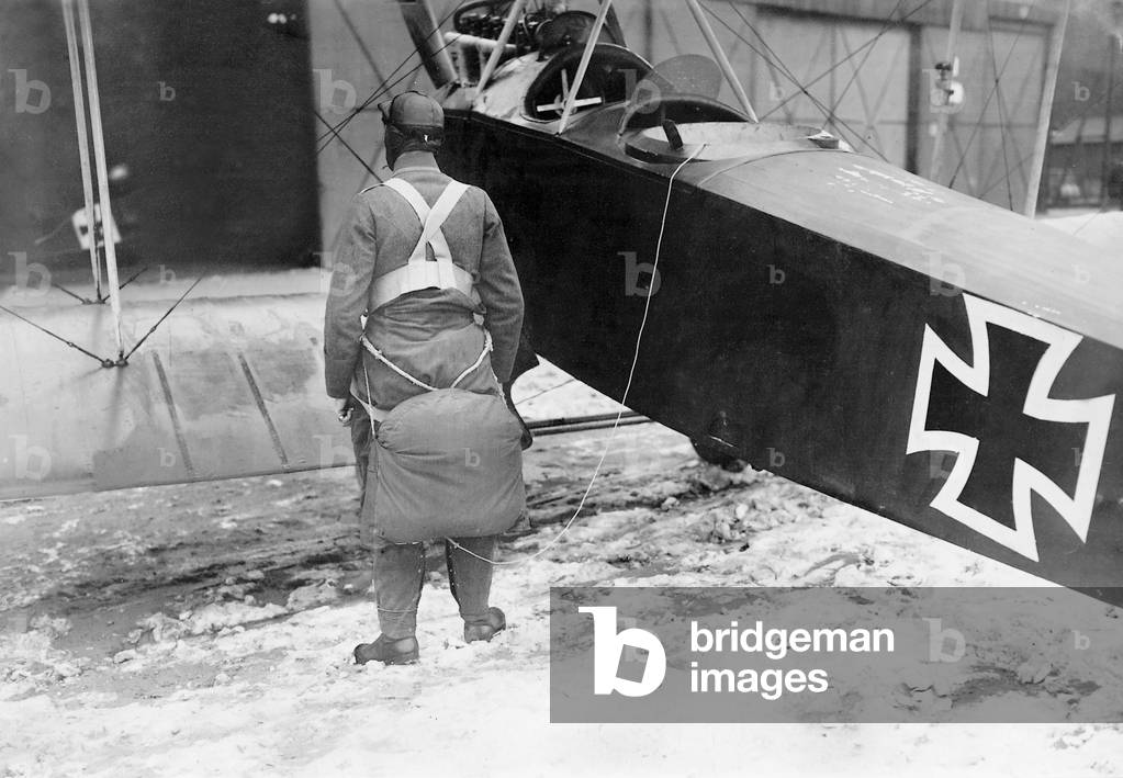 Fighter pilot with parachute, 1918 (b/w photo)
