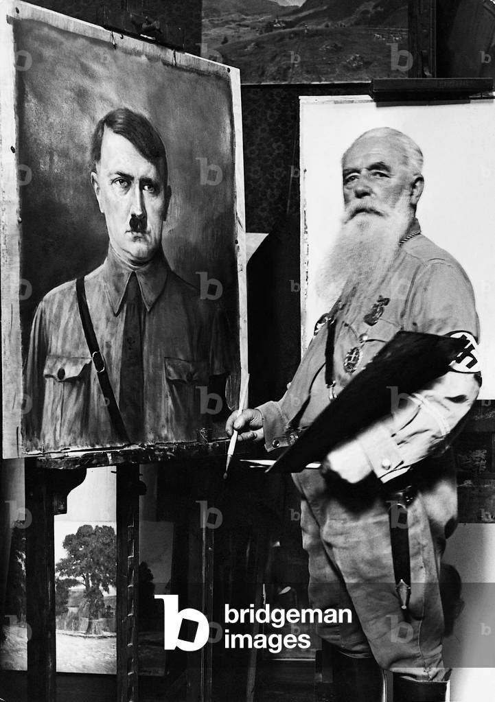Friedrich Reimann with a picture of Hitler, 1935 (b/w photo)