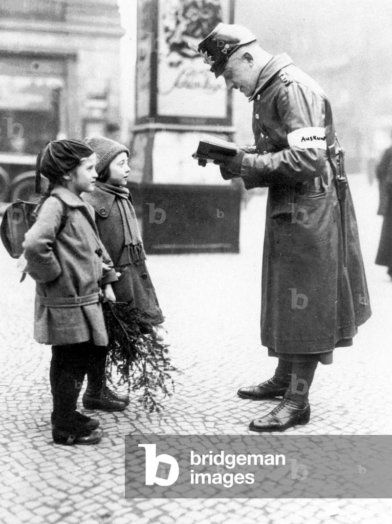 Traffic policeman with children in Berlin (b/w photo)