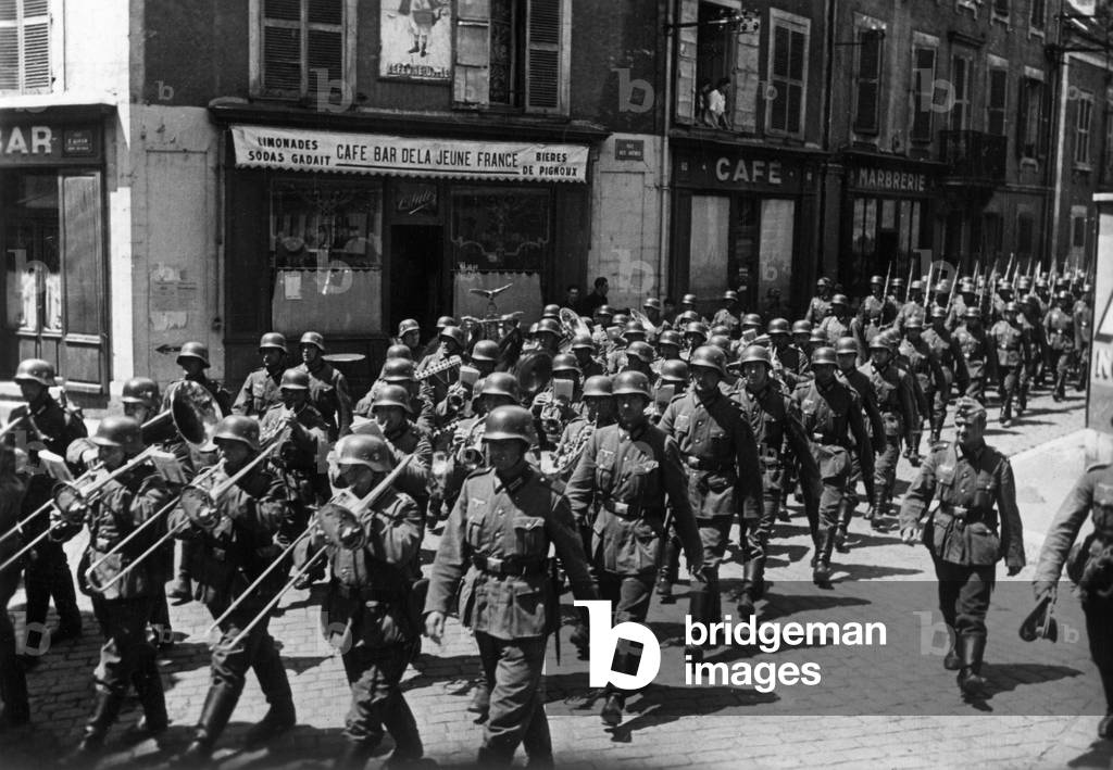 A German military band marches through a French town, 1940