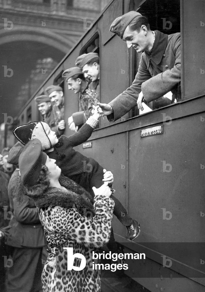 Departure of a soldier on leave at the train station (b/w photo)