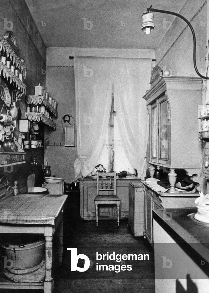 Typical bourgeois kitchen, early 20th century (b/w photo)