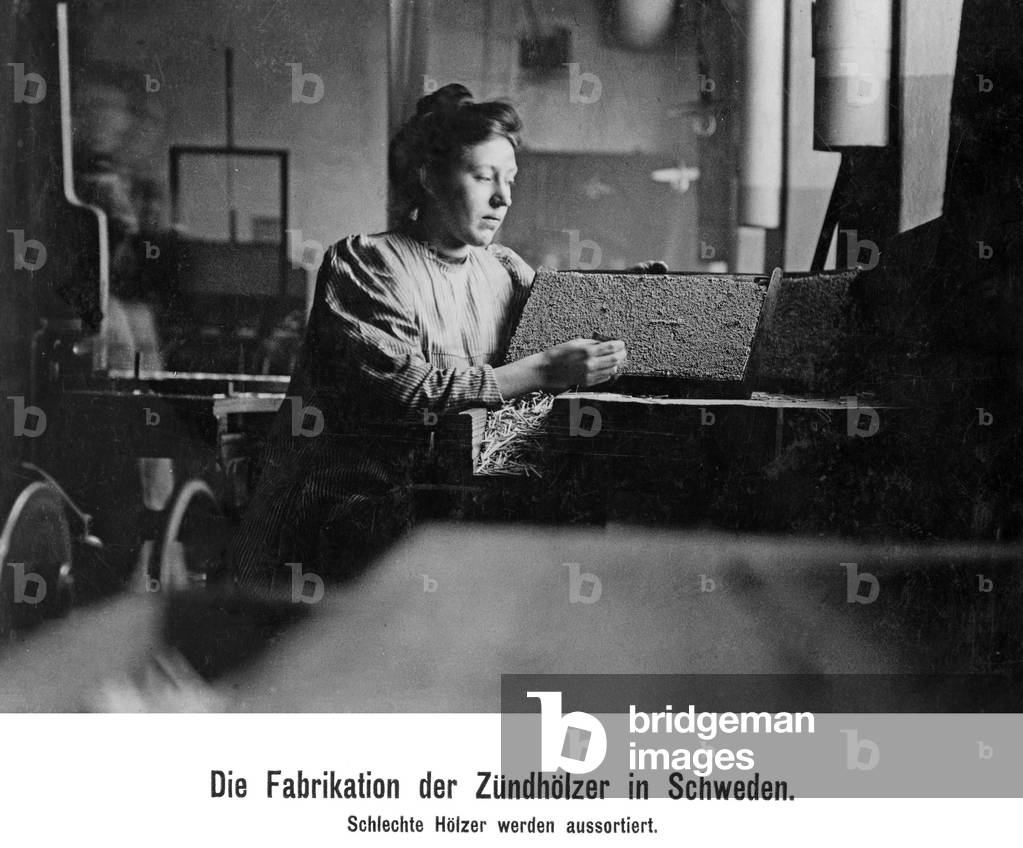 A woman in a match factory, 1910 (b/w photo)