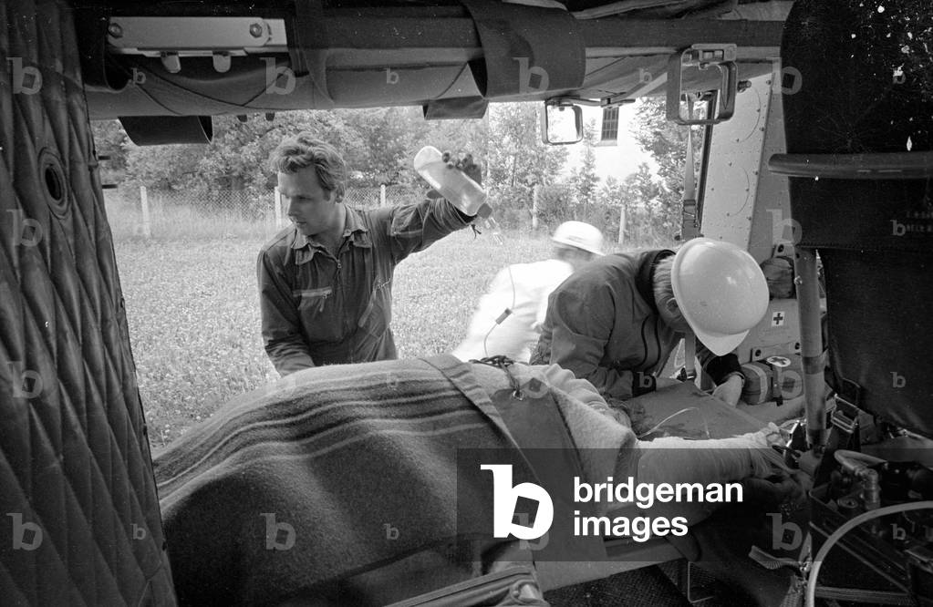 A victim is made ready for transport, 1970 (b/w photo)