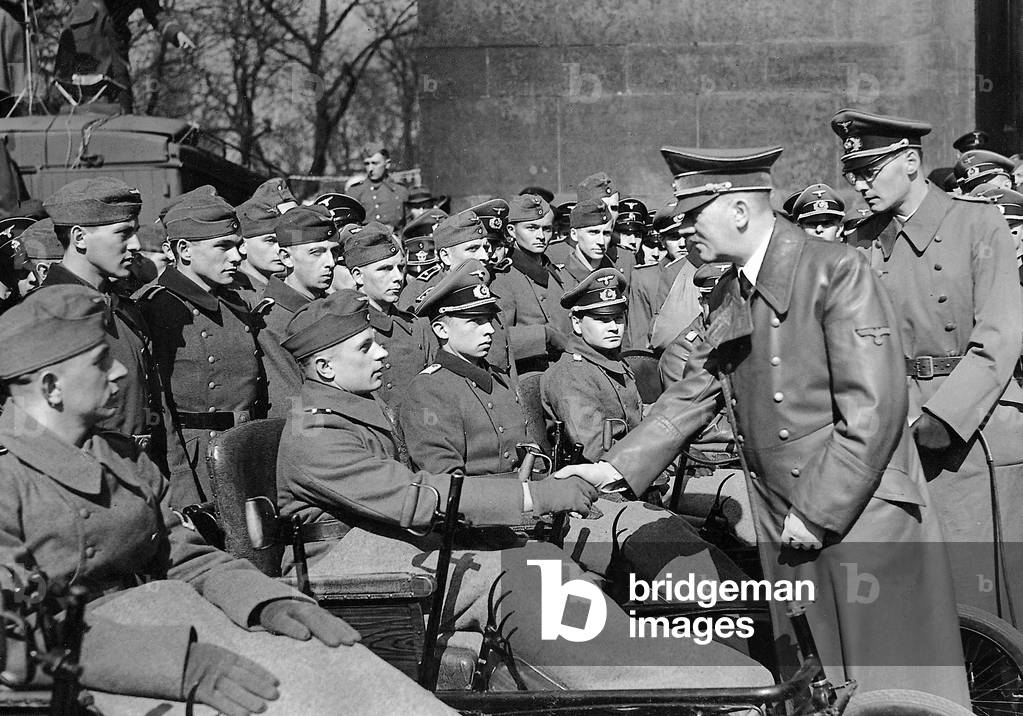 Adolf Hitler with war wounded, 1943 (b/w photo)
