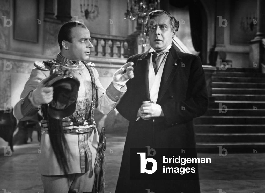Heinz Ruehmann during a movie scene. 1930