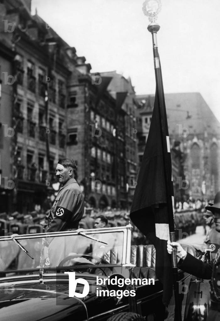 Adolf Hitler attends the great parade in Nuremberg, 1937 (b/w photo)