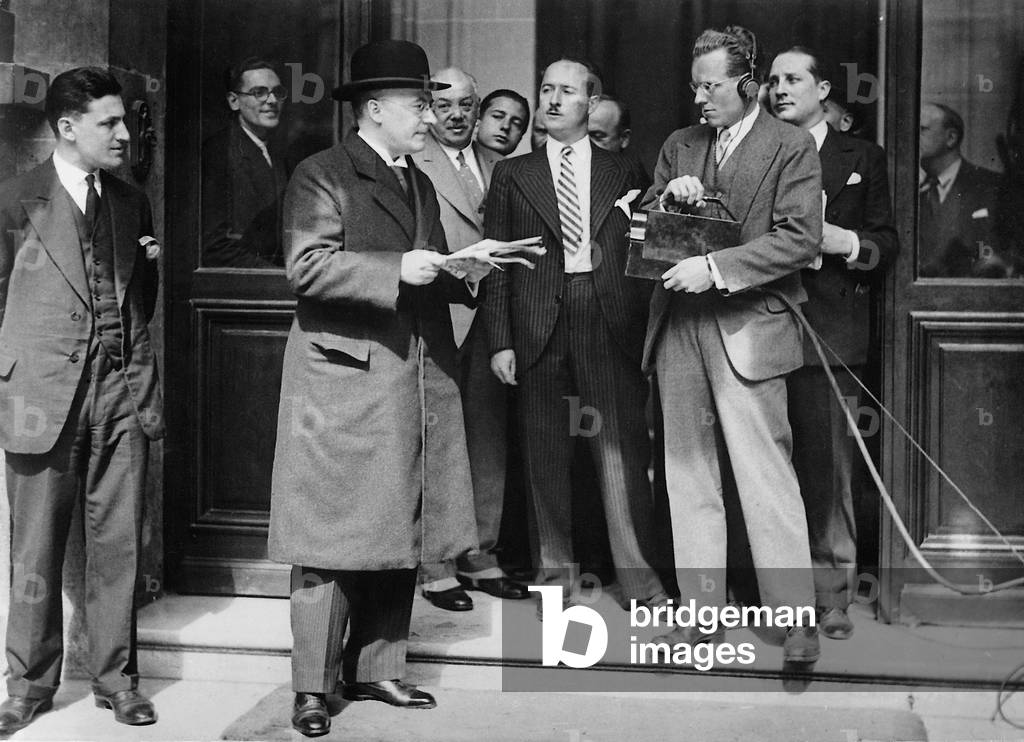 Heinrich Bruening in front of the entrance to the Interior Ministry in Paris, 1931 (b/w photo)
