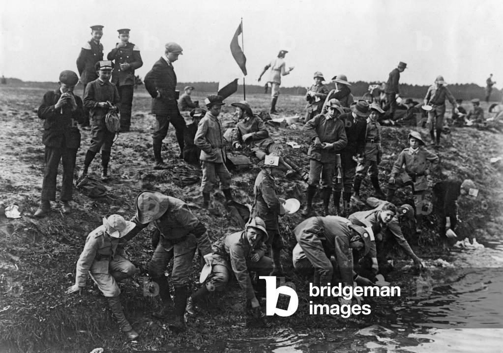 Boy scouts during a war game, 1913 (b/w photo)