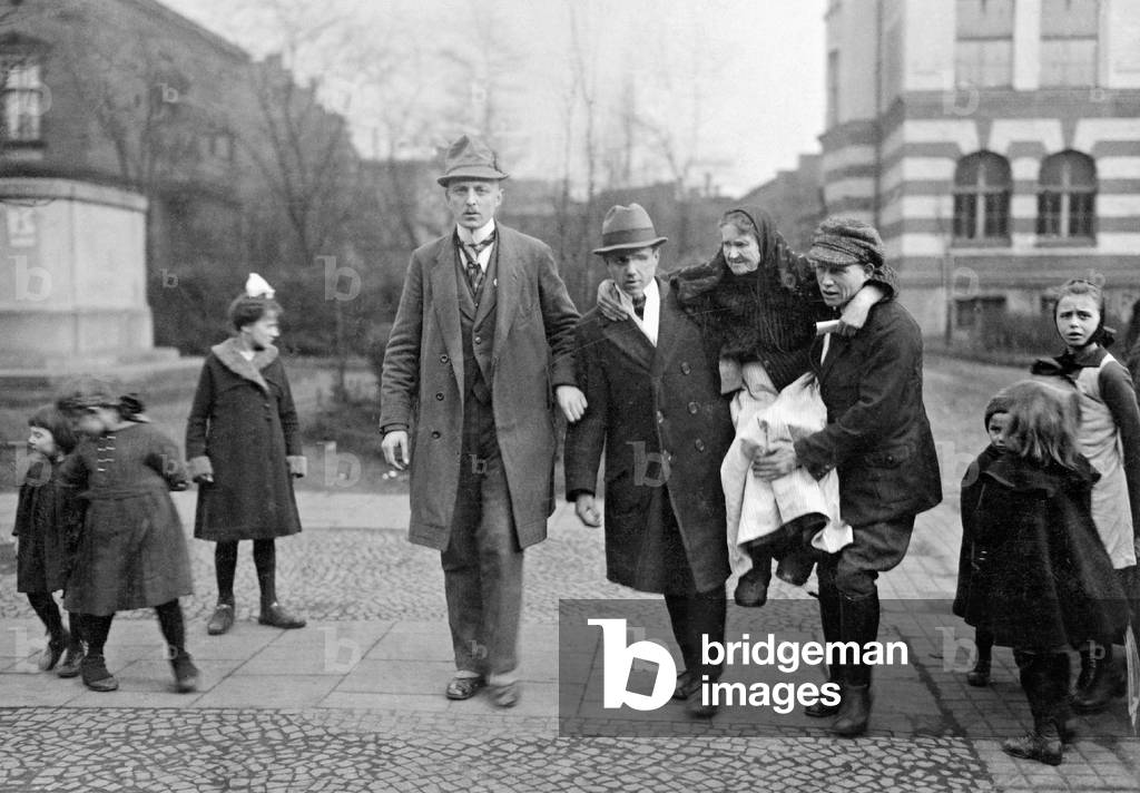 An old woman is carried to the polling station, 1921 (b/w photo)