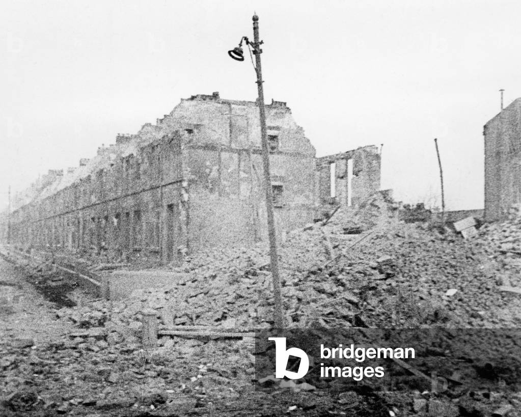 Destroyed building following an air raid during the Blitz (b/w photo)