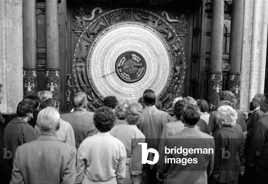 Tourists in front of the Astronomical Clock in the Marienkirche, 1963 (b/w photo)