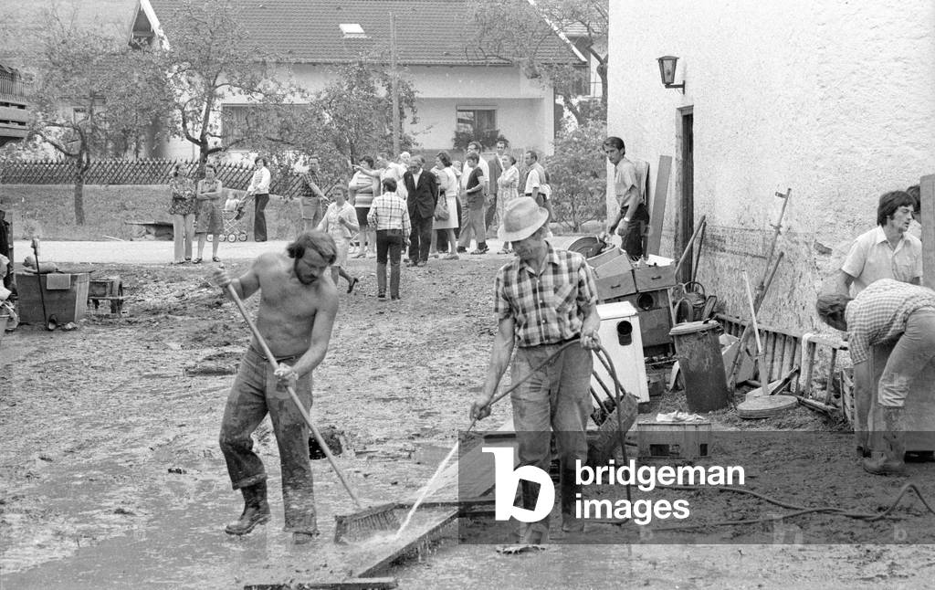 Cleaning up after a storm at Lake Chiemsee, 1974 (b/w photo)