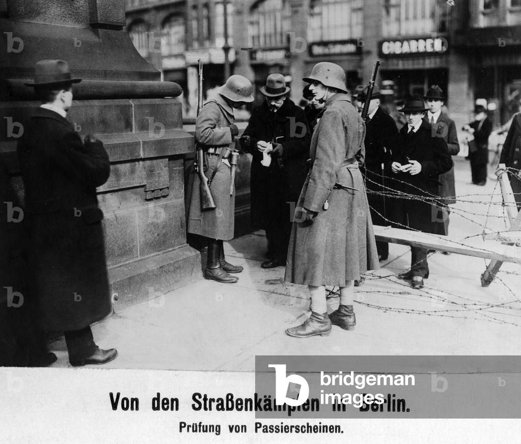 Identity check during the Maerzkaempfe (March Fights) in Berlin, 1919