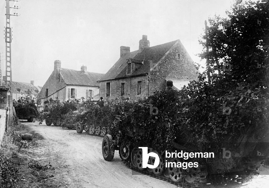German armored vehicles in a village in France, 1944 (b/w photo)